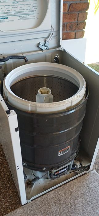 Top-load washing machine opened for drum and motor repair