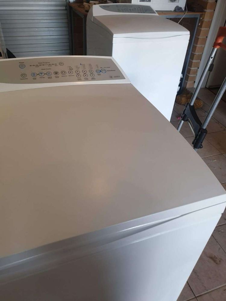 Top-load washing machines at a Sydney customer's home before repair